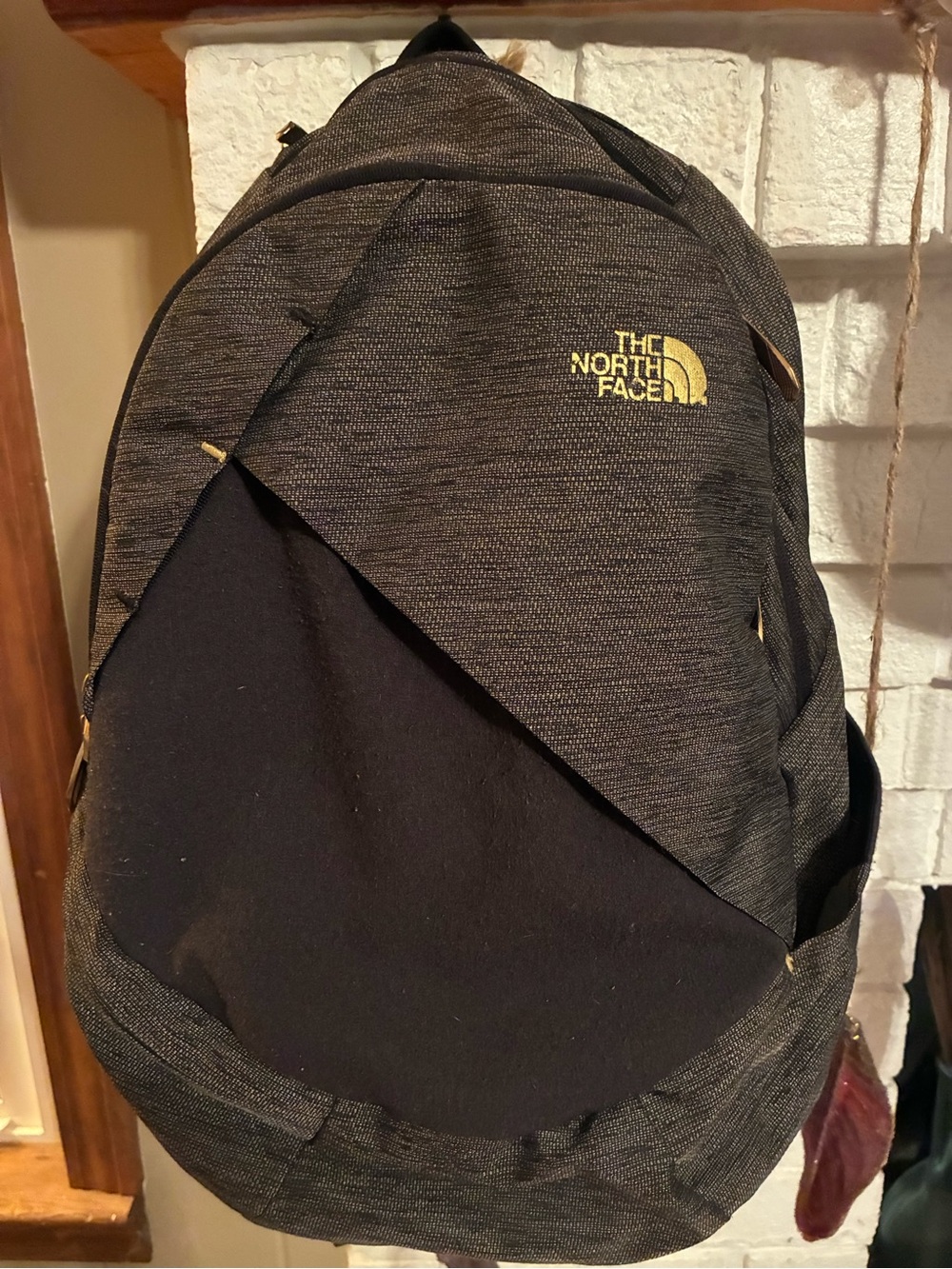 The North Face Black Heather Backpack with Yellow Logo